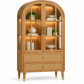 Vitrine beige en arche à portes vitrées et deux tiroirs tressés