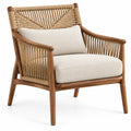 Fauteuil beige et marron à dossier tressé ajouré et coussins clairs
