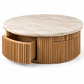Table basse ronde beige à tiroirs courbés et plateau clair veiné