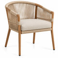 Chaise beige à dossier enveloppant ajouré et coussin clair